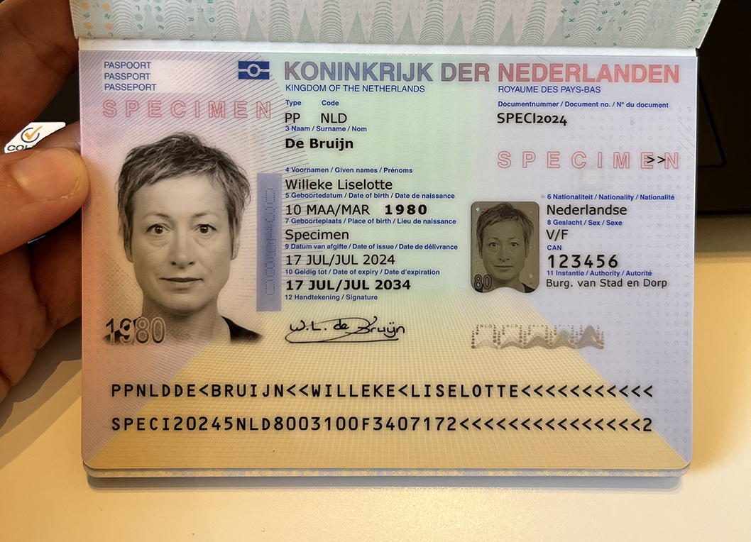 OK: Shows the whole passport photo page with edges and some surroundings